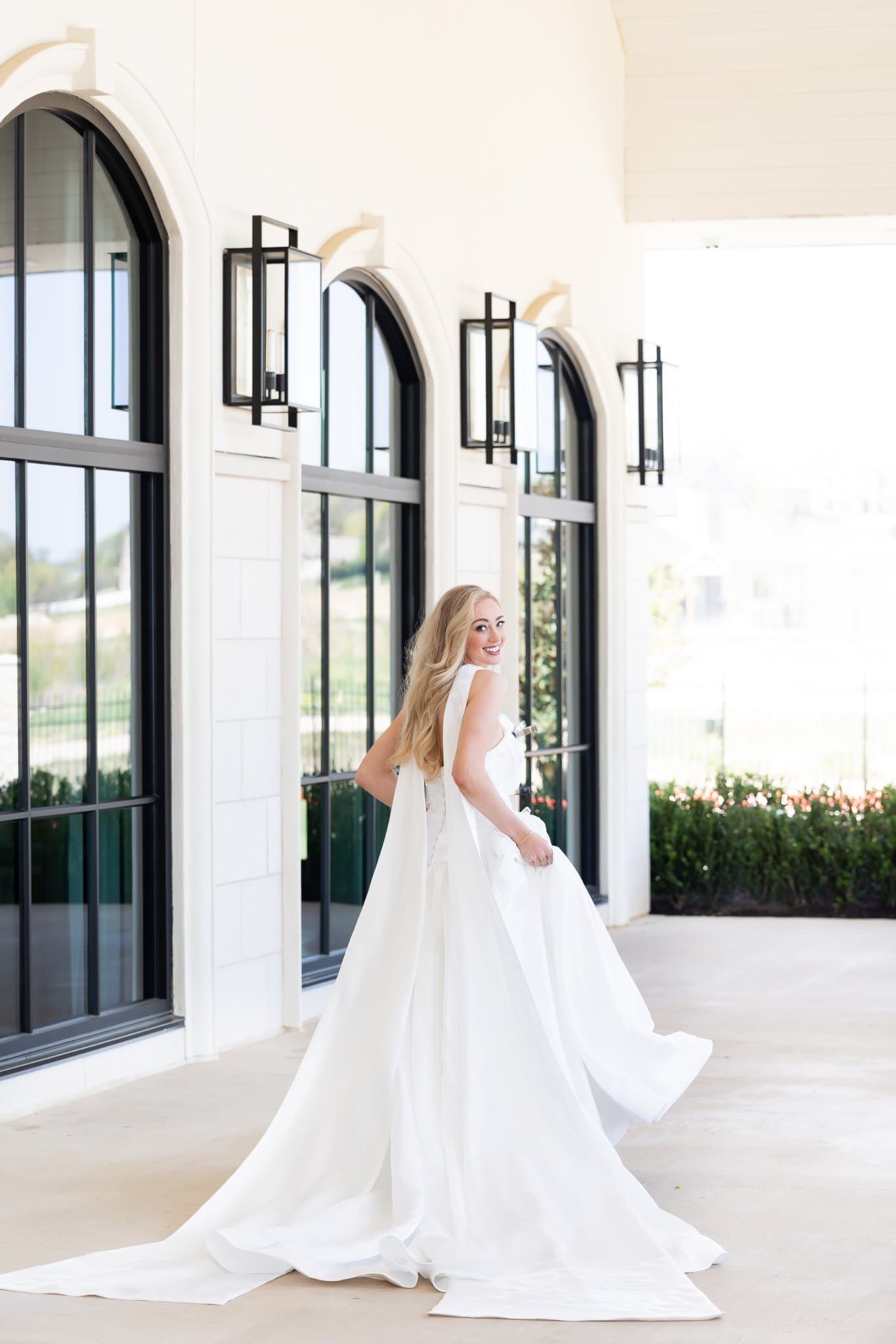 Bride in a made-to-order wedding gown by Lily and Lace Bride, Dallas