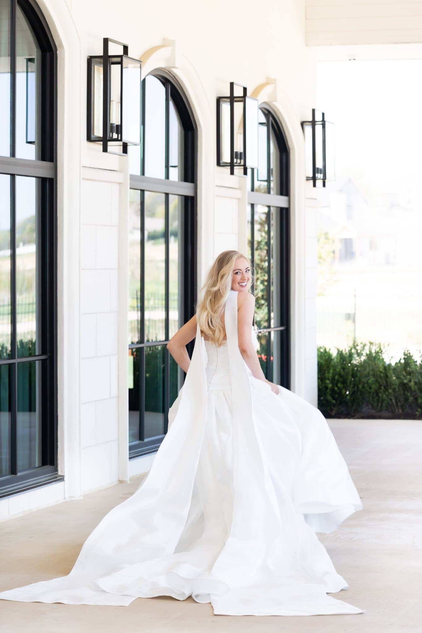 Bride in gown with dramatic train — Lily and Lace Bride